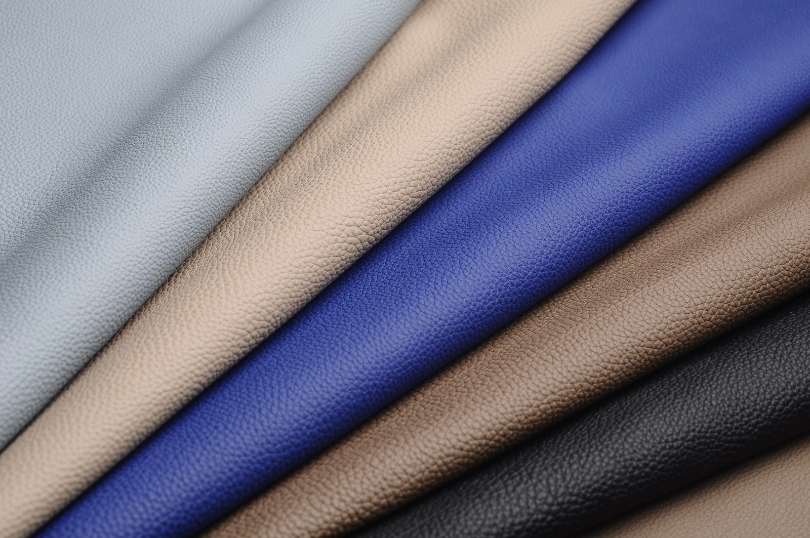 Textured leather rolls in light blue, beige, navy, brown and black