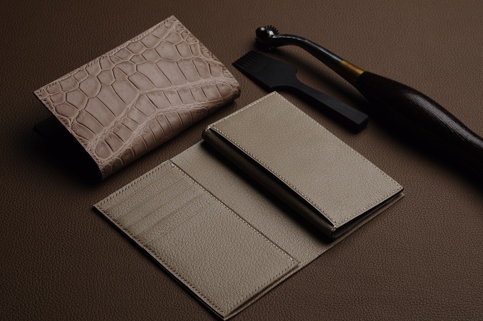 White and khaki card holders and pocket components arranged with black tools