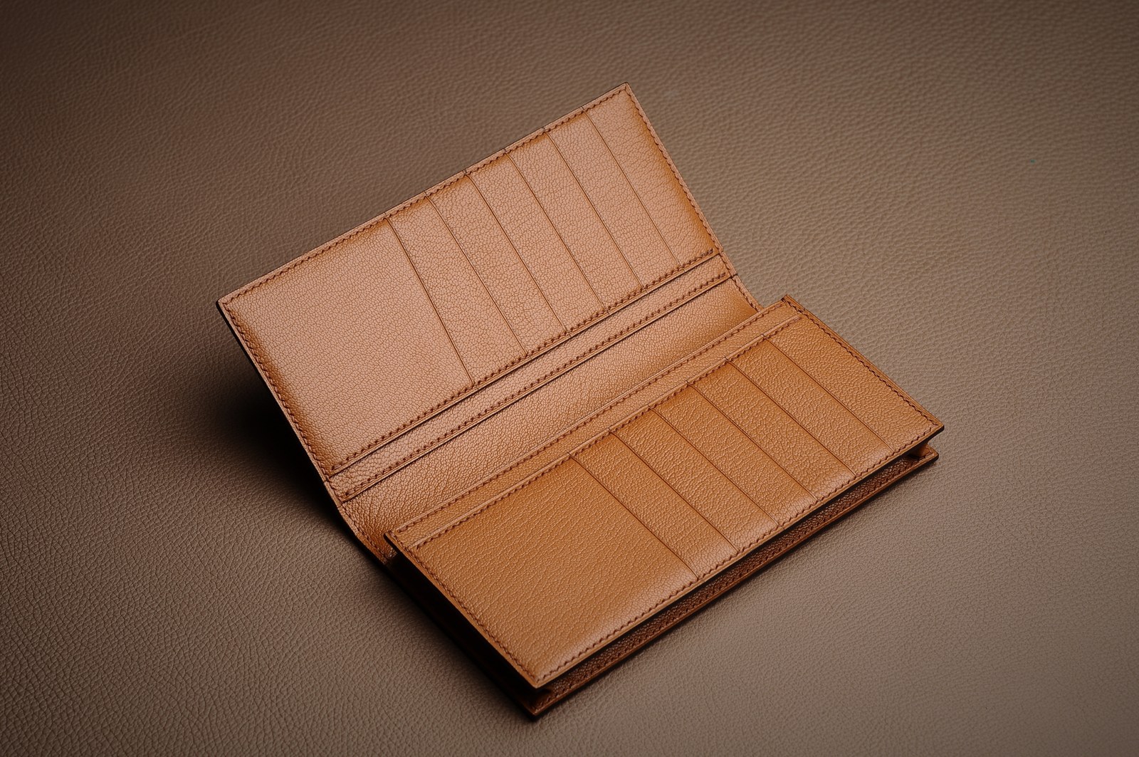 Open tan custom leather wallet showing card slots and compartments