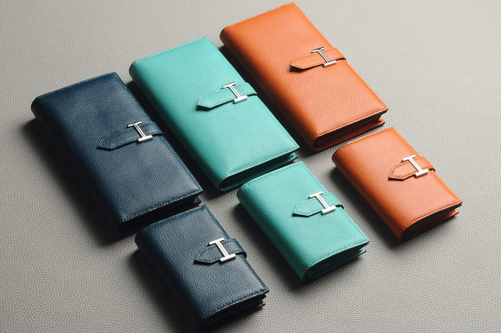 Coordinated black, teal and orange small leather goods